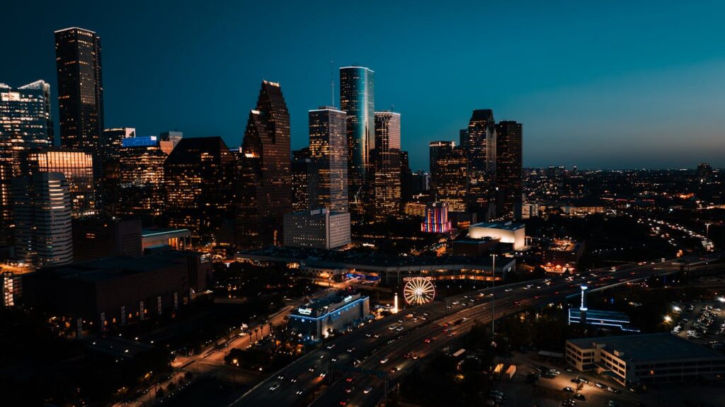 Crafting Captivating Headlines: Your awesome post title goes here Stunning aerial view of downtown Houston's illuminated skyscrapers at dusk.